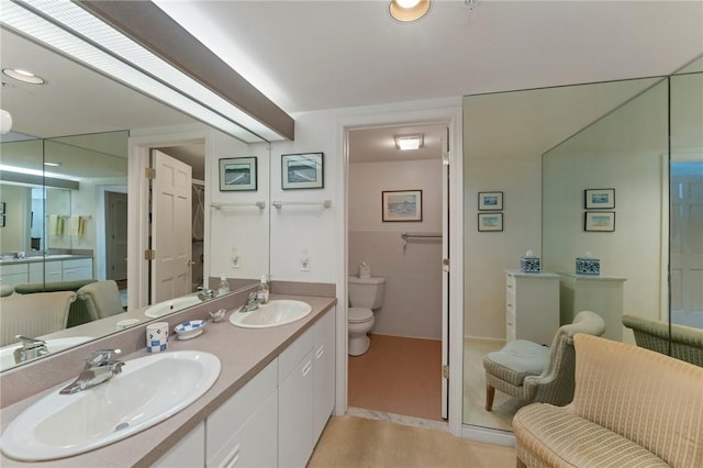 53 Conanicus Ave Unit 5A, Jamestown, RI 02835 - bathroom featuring double vanity, a sink, and toilet