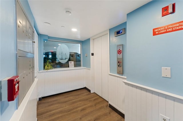 53 Conanicus Ave Unit 5A, Jamestown, RI 02835 - hall featuring wood finished floors and a wainscoted wall