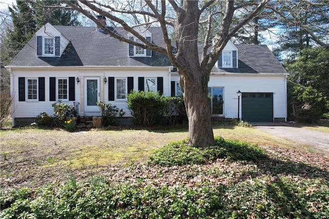23 Rockland Dr, South Kingstown, RI 02879 - new england style home with an attached garage, driveway, and a front lawn