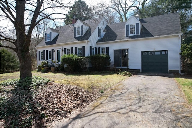 23 Rockland Dr, South Kingstown, RI 02879 - cape cod house featuring driveway, a chimney, an attached garage, and a front lawn