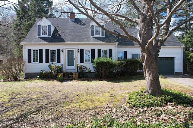 23 Rockland Dr, South Kingstown, RI 02879 - cape cod house featuring concrete driveway, a garage, and a chimney