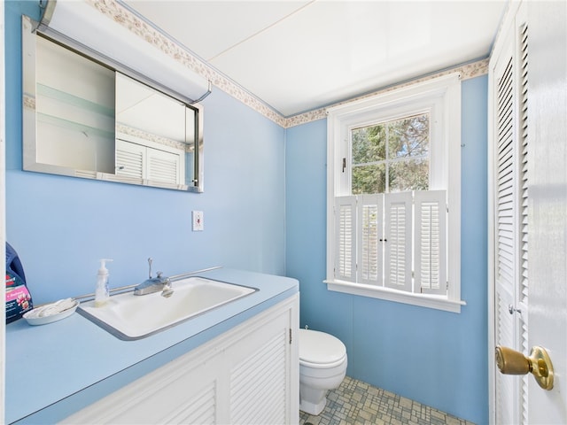 23 Rockland Dr, South Kingstown, RI 02879 - half bath featuring tile patterned flooring, vanity, and toilet