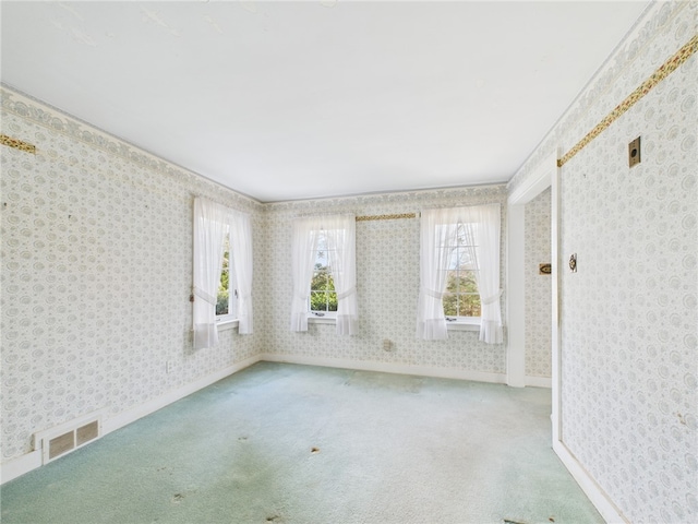 23 Rockland Dr, South Kingstown, RI 02879 - empty room with wallpapered walls, carpet, and visible vents