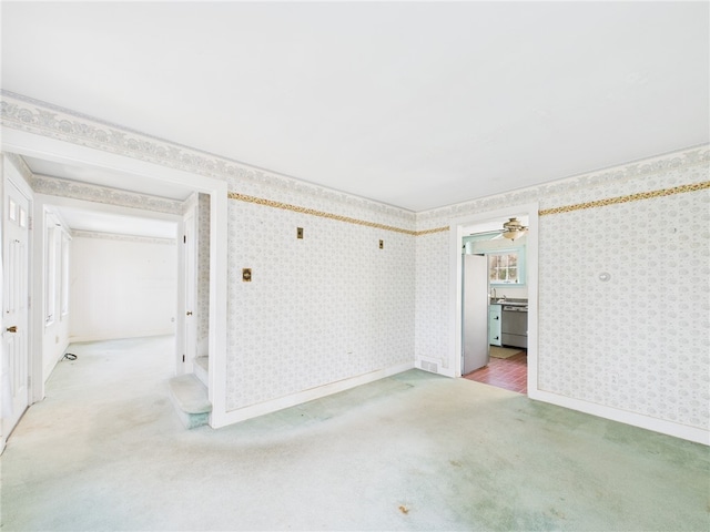 23 Rockland Dr, South Kingstown, RI 02879 - unfurnished room featuring baseboards, light colored carpet, and wallpapered walls
