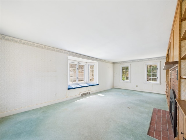 23 Rockland Dr, South Kingstown, RI 02879 - unfurnished living room featuring a fireplace, carpet flooring, visible vents, and baseboards