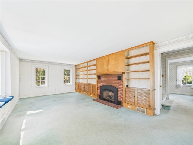 23 Rockland Dr, South Kingstown, RI 02879 - unfurnished living room with wallpapered walls, visible vents, a fireplace, and carpet