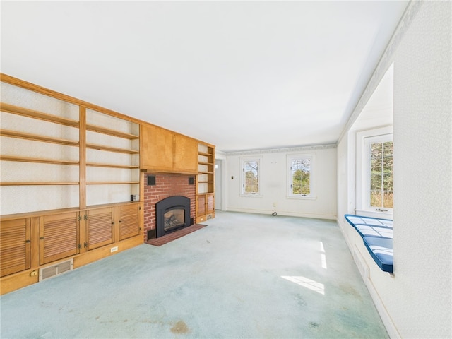 23 Rockland Dr, South Kingstown, RI 02879 - unfurnished living room with baseboards, a brick fireplace, carpet, and visible vents
