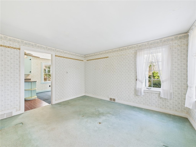 23 Rockland Dr, South Kingstown, RI 02879 - carpeted empty room with wallpapered walls, baseboards, and visible vents