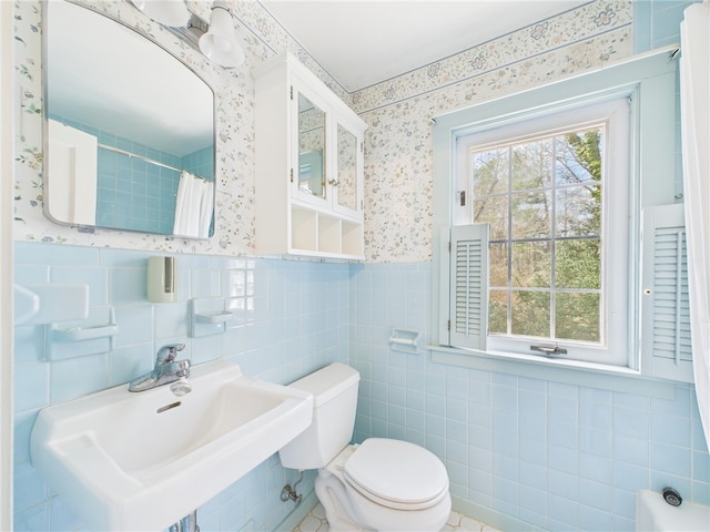 23 Rockland Dr, South Kingstown, RI 02879 - full bath with wallpapered walls, tile walls, a sink, and toilet