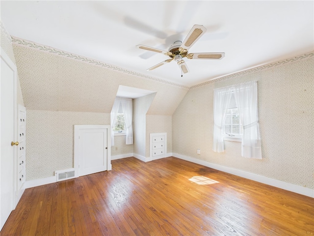 23 Rockland Dr, South Kingstown, RI 02879 - bonus room featuring visible vents, baseboards, a ceiling fan, hardwood / wood-style flooring, and vaulted ceiling