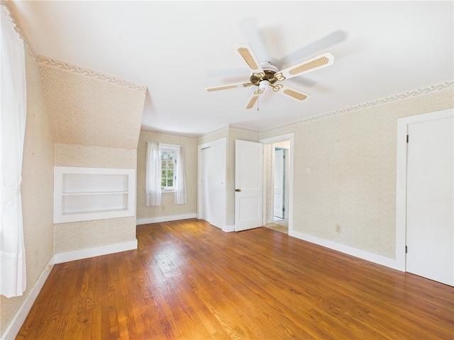 23 Rockland Dr, South Kingstown, RI 02879 - unfurnished living room with baseboards, wallpapered walls, a ceiling fan, and wood finished floors