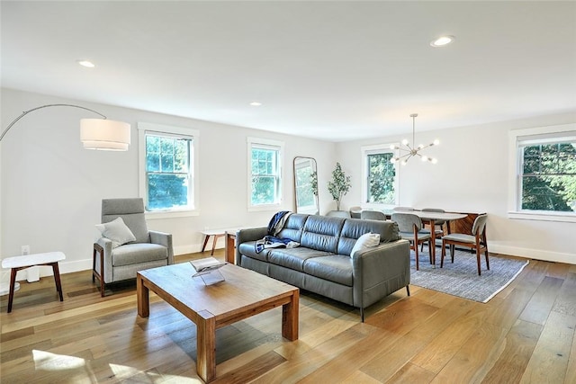 137 Rosebriar Ave, South Kingstown, RI 02879 - living room with plenty of natural light, a chandelier, and light wood-style floors