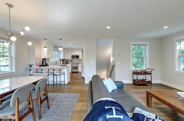 137 Rosebriar Ave, South Kingstown, RI 02879 - living room with light wood-style flooring, recessed lighting, and baseboards