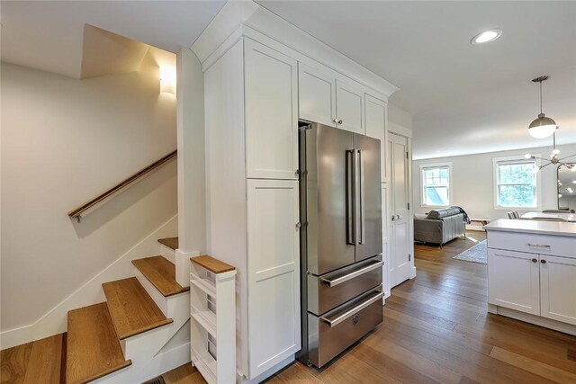137 Rosebriar Ave, South Kingstown, RI 02879 - kitchen featuring white cabinets, open floor plan, hardwood / wood-style flooring, and freestanding refrigerator