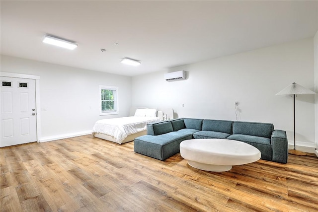 137 Rosebriar Ave, South Kingstown, RI 02879 - bedroom featuring wood finished floors, an AC wall unit, and baseboards