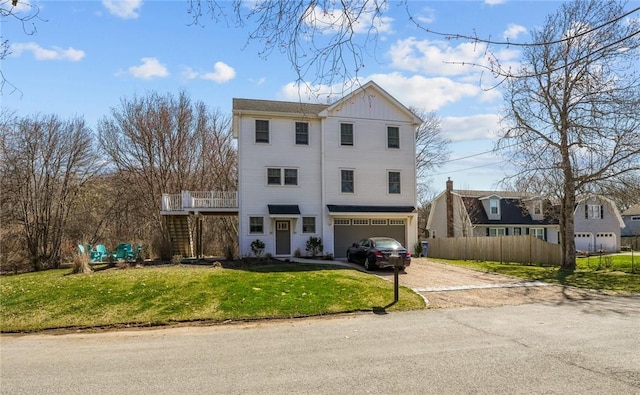 137 Rosebriar Ave, South Kingstown, RI 02879 - view of front of property featuring an attached garage, a front lawn, concrete driveway, and fence