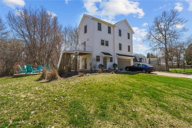 137 Rosebriar Ave, South Kingstown, RI 02879 - exterior space with stairway, driveway, a deck, an attached garage, and a yard