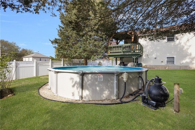 view of pool featuring fence, a fenced in pool, and a lawn