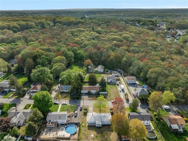 aerial view with a wooded view and a residential view