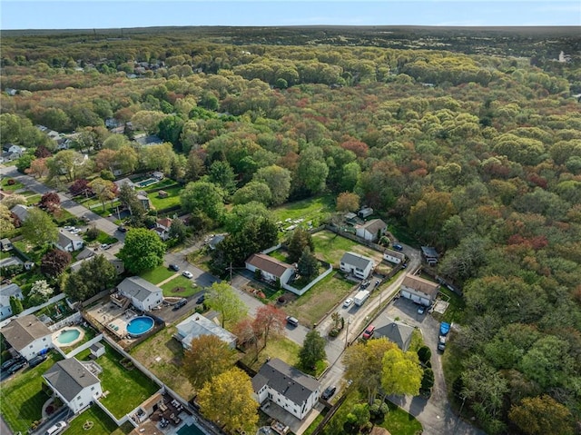aerial view featuring a wooded view