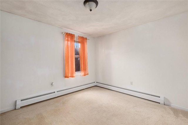 empty room featuring carpet and a baseboard radiator