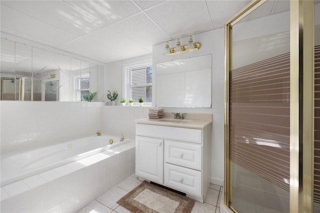 bathroom featuring tile patterned floors, a shower stall, vanity, and a bath