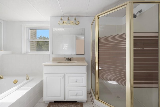 full bathroom featuring tile patterned floors, a garden tub, vanity, and a shower stall