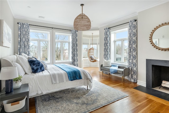 78 Rhode Island Ave Unit 5, Newport, RI 02840 - bedroom with visible vents, wood finished floors, ornamental molding, and multiple windows