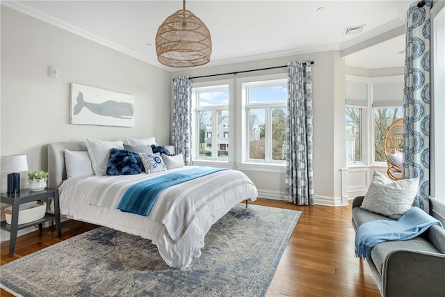 78 Rhode Island Ave Unit 5, Newport, RI 02840 - bedroom featuring ornamental molding, visible vents, wood finished floors, and multiple windows