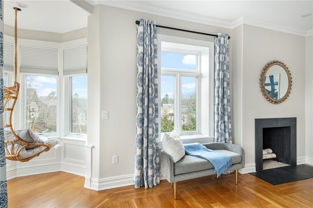 78 Rhode Island Ave Unit 5, Newport, RI 02840 - living area with crown molding, a fireplace with flush hearth, wood finished floors, and baseboards
