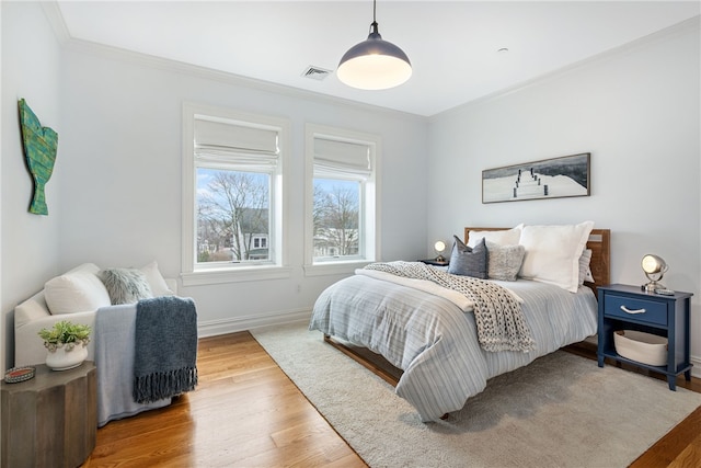 78 Rhode Island Ave Unit 5, Newport, RI 02840 - bedroom featuring wood finished floors, crown molding, visible vents, and baseboards