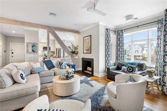78 Rhode Island Ave Unit 5, Newport, RI 02840 - living area featuring recessed lighting, ceiling fan, light wood finished floors, baseboards, and crown molding