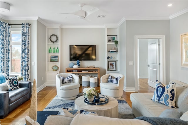 78 Rhode Island Ave Unit 5, Newport, RI 02840 - living room featuring wood finished floors, ornamental molding, ceiling fan, baseboards, and visible vents