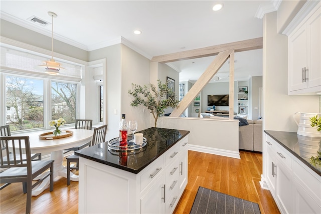 78 Rhode Island Ave Unit 5, Newport, RI 02840 - kitchen featuring light wood finished floors, recessed lighting, visible vents, white cabinetry, and ornamental molding