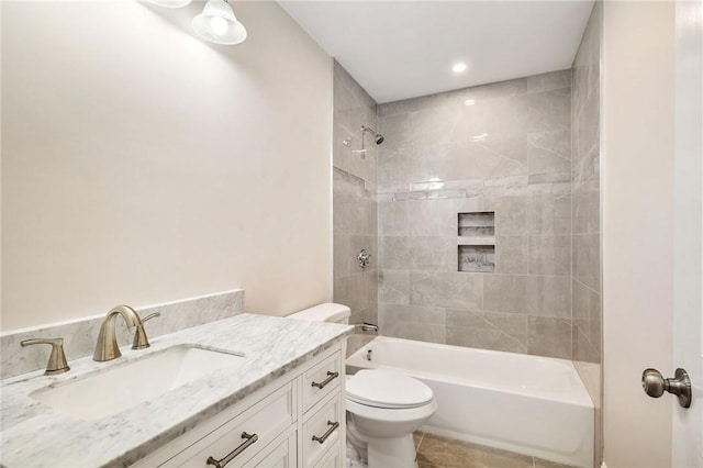 full bathroom with tile patterned floors, shower / bath combination, vanity, and toilet