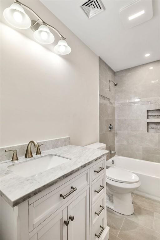 full bathroom featuring visible vents, toilet,  shower combination, vanity, and tile patterned floors