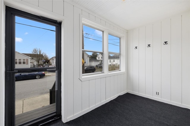 interior space featuring dark carpet