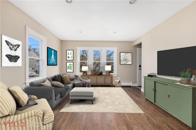 living room with a wealth of natural light, recessed lighting, dark wood-style flooring, and a baseboard radiator