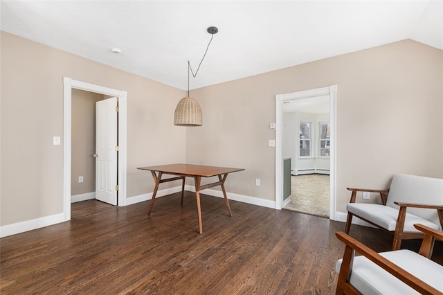 dining room with baseboards, baseboard heating, vaulted ceiling, and dark wood-style floors