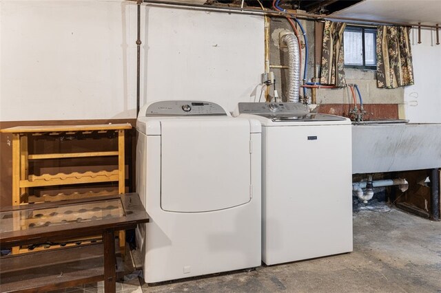 laundry area featuring washer and clothes dryer and laundry area