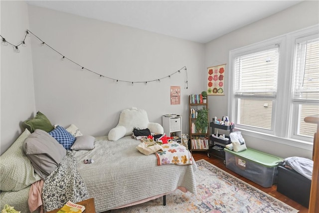 bedroom featuring wood finished floors