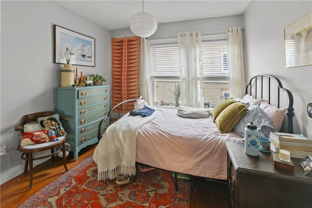 bedroom with wood finished floors