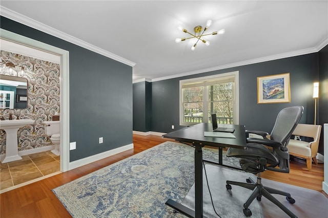 office space with baseboards, ornamental molding, wood finished floors, and a notable chandelier