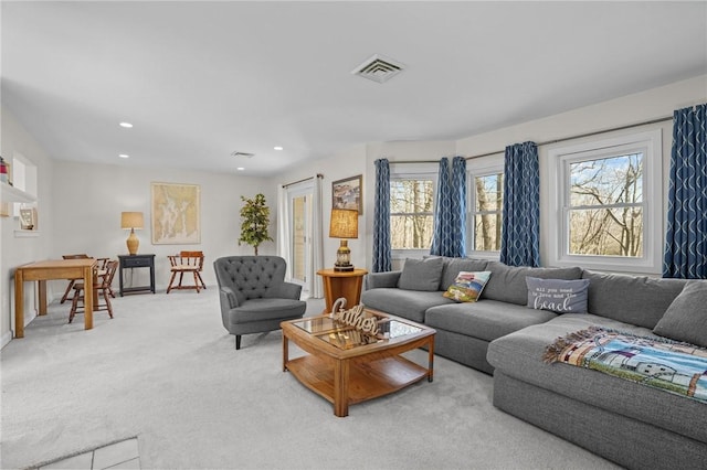 living room featuring light colored carpet, baseboards, visible vents, and recessed lighting