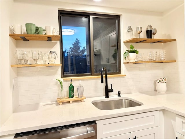 bar with dishwasher, a sink, and decorative backsplash