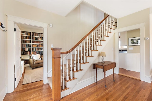 staircase featuring wood finished floors