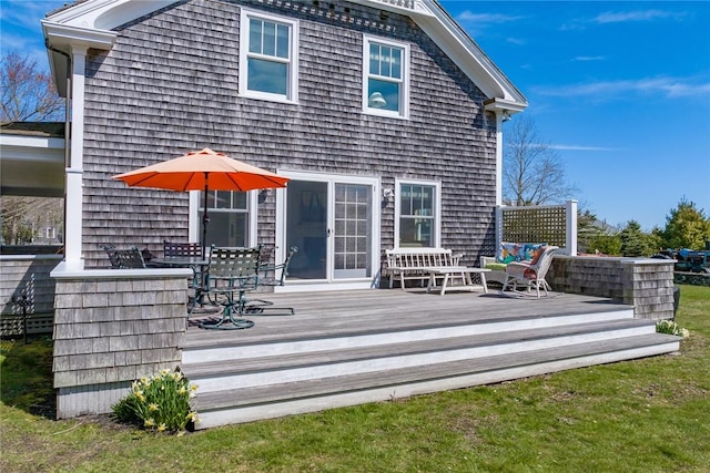 back of property featuring a deck