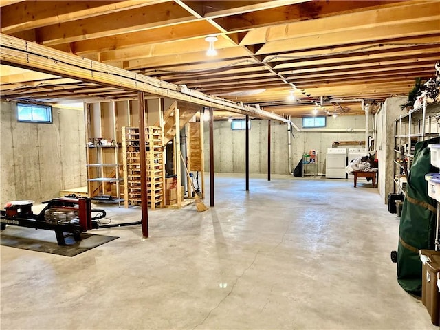 below grade area featuring a healthy amount of sunlight and washer and dryer