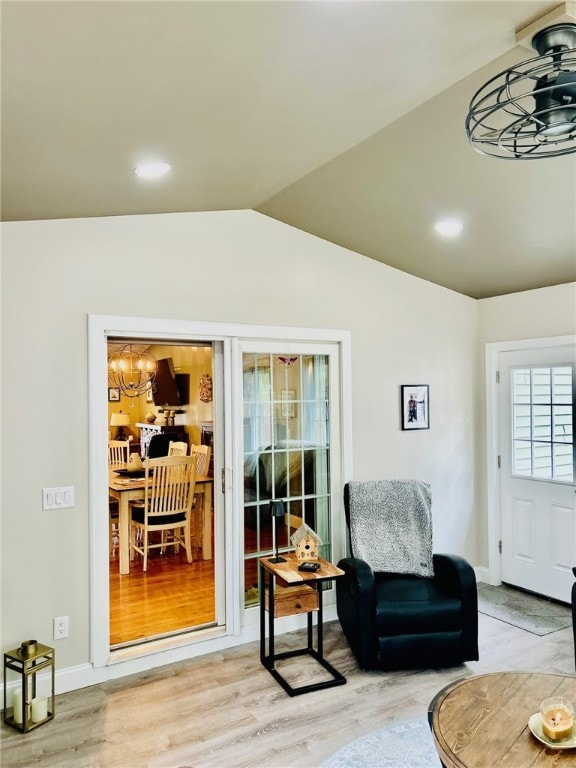 interior space featuring vaulted ceiling and wood finished floors