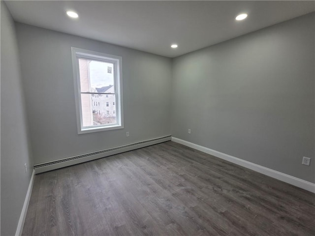 unfurnished room with recessed lighting, baseboards, a baseboard radiator, and dark wood finished floors
